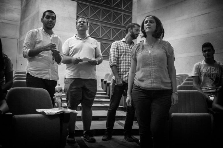 Mai rehearsing a solo as of a four voices choir arrangement 